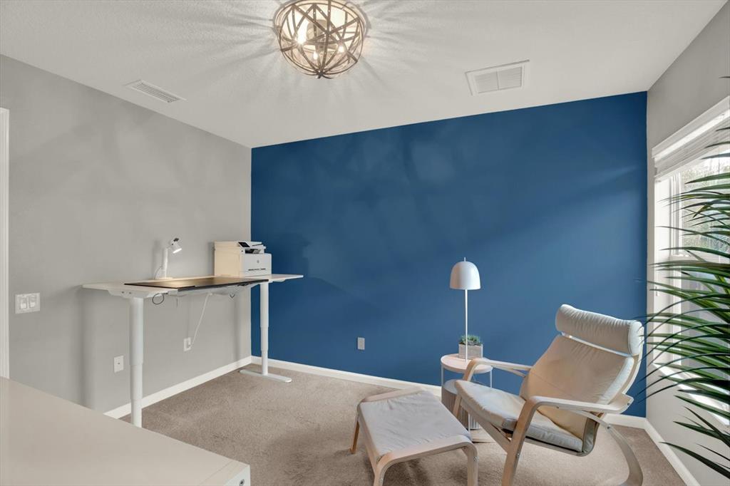 10228 Red Currant Court Riverview, FL 33578 - Photo 24 of 37 a workspace with furniture and chandelier