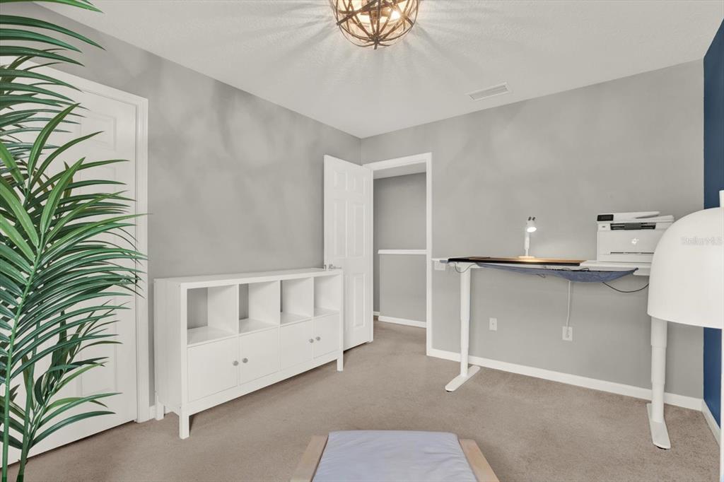 10228 Red Currant Court Riverview, FL 33578 - Photo 25 of 37 a view of an empty room with a window