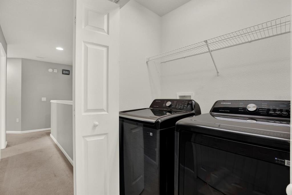 10228 Red Currant Court Riverview, FL 33578 - Photo 30 of 37 a utility room with dryer and washer