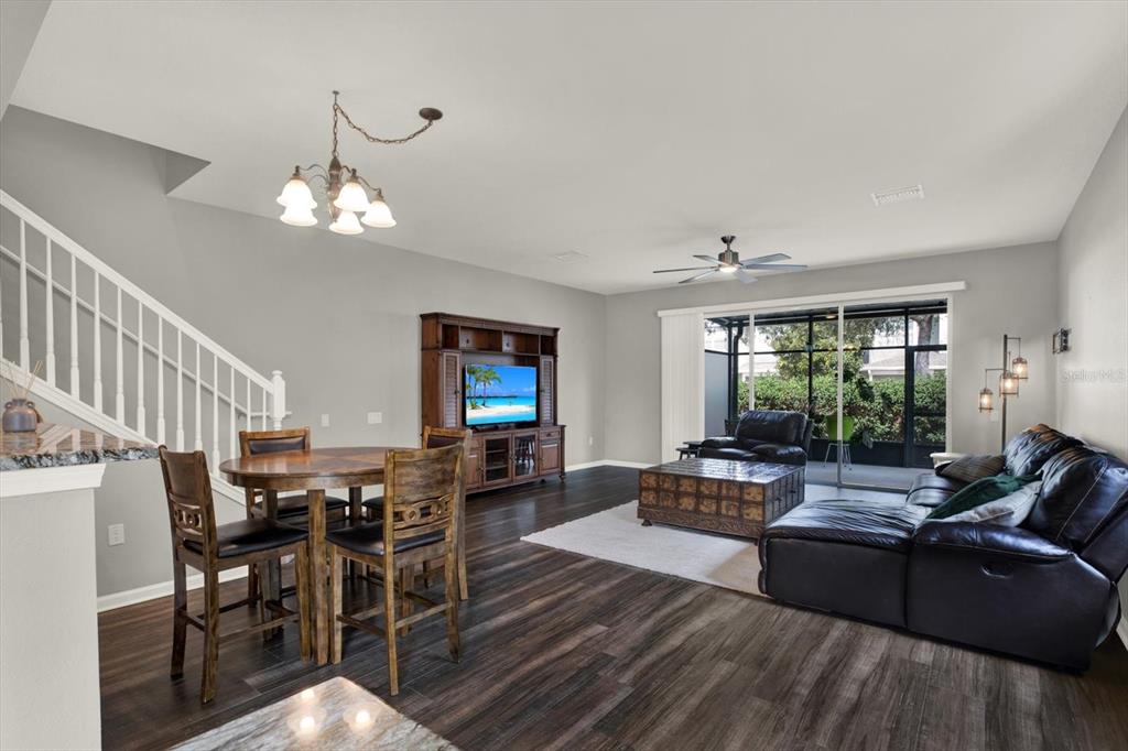 10228 Red Currant Court Riverview, FL 33578 - Photo 7 of 37 a living room with furniture kitchen view and a large window