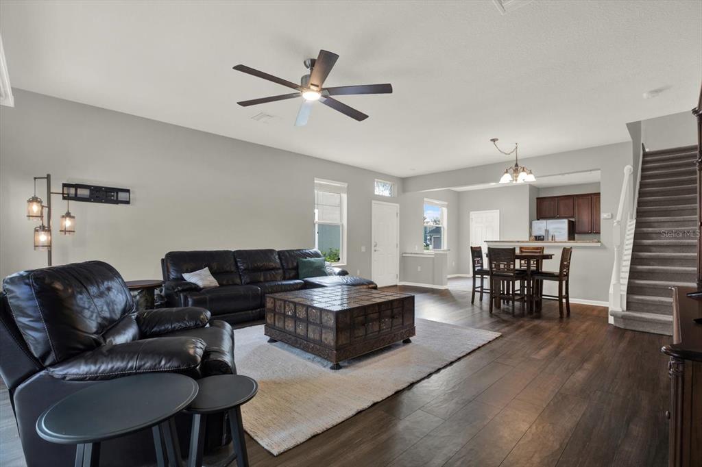 10228 Red Currant Court Riverview, FL 33578 - Photo 9 of 37 a living room with furniture and a wooden floor