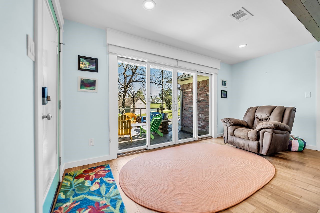 310 Cove Loop Coldspring, TX 77331 - Photo 11 of 48 Off the living room is a sitting area with a nice view of the lake.