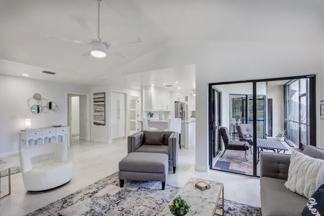 a kitchen with a refrigerator cabinets and wooden floor