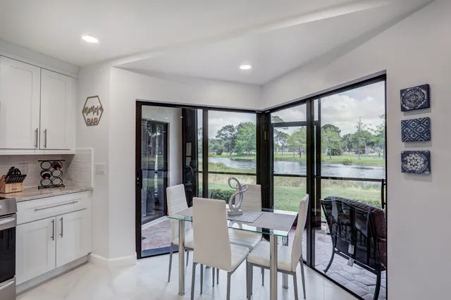 a bathroom with a toilet a sink a mirror and vanity