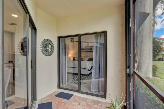 a view of a house with a yard and plants