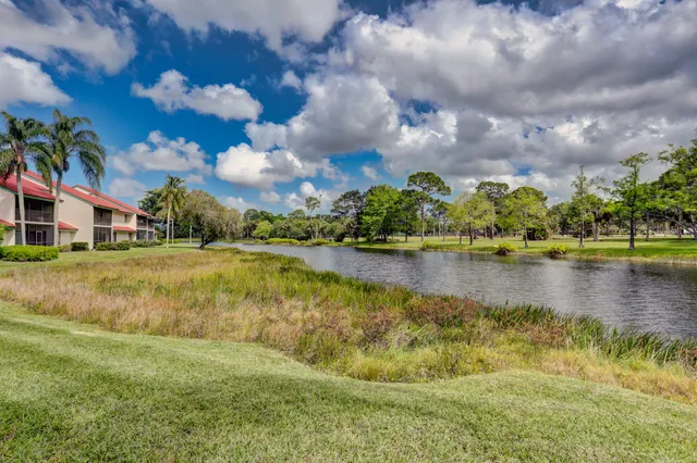 an aerial view of house with yard swimming pool and mountain view