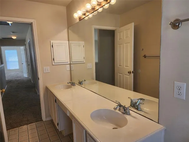 a view of a hallway with a room