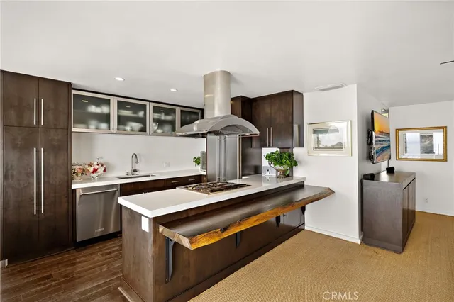 a kitchen with stainless steel appliances a sink and a stove