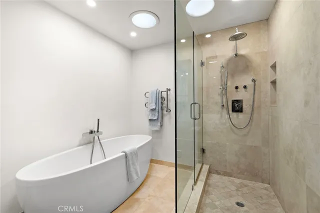 a bathroom with a bathtub and a sink