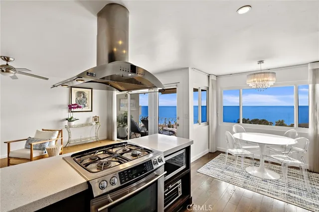 a kitchen with stainless steel appliances granite countertop a stove and a sink