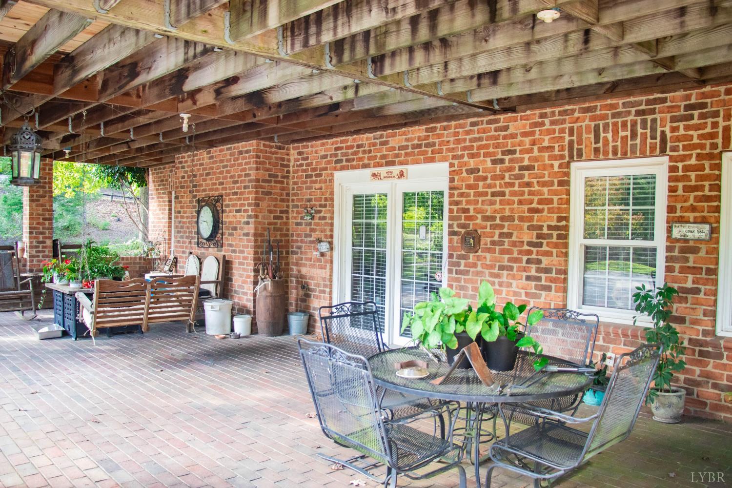 224 Walnut Road Danville, VA 24541 - Photo 40 of 63 a patio with patio outdoor seating and yard