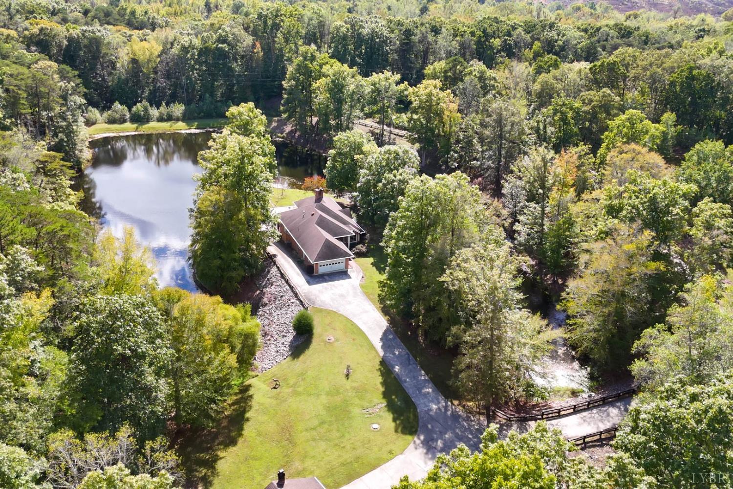 224 Walnut Road Danville, VA 24541 - Photo 51 of 63 an aerial view of residential house with outdoor space and trees all around