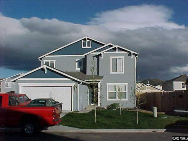 7610 Bichon Street Reno, NV 89506 - Photo 1 of 4 a front view of a house with garden