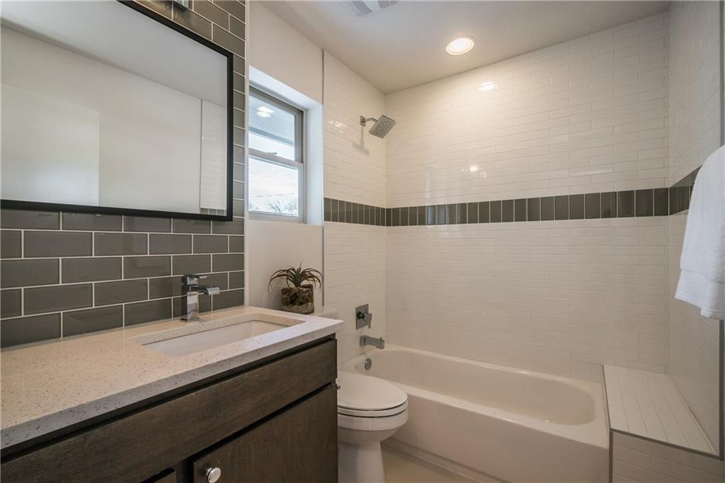 2803 Crest Avenue, Unit A Austin, TX 78702 - Photo 14 of 17 a bathroom with a sink a toilet and shower