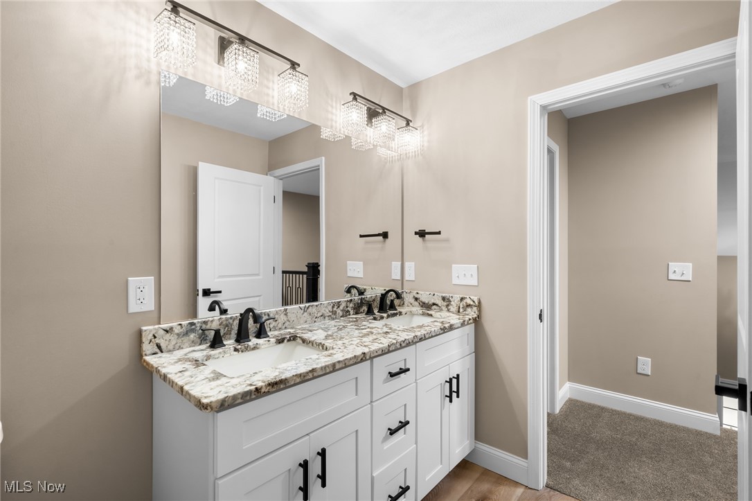 39600 Aurora Road Solon, OH 44139 - Photo 37 of 49 Full bath featuring double vanity and baseboards
