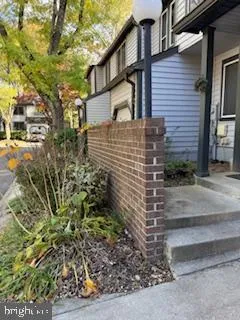 a view of a brick house with a yard