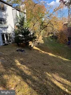 a view of a yard with a house