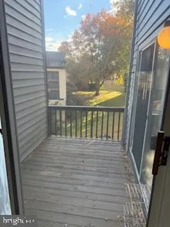a view of a balcony with wooden floor
