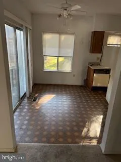 a view of a room with a window and a wooden floor