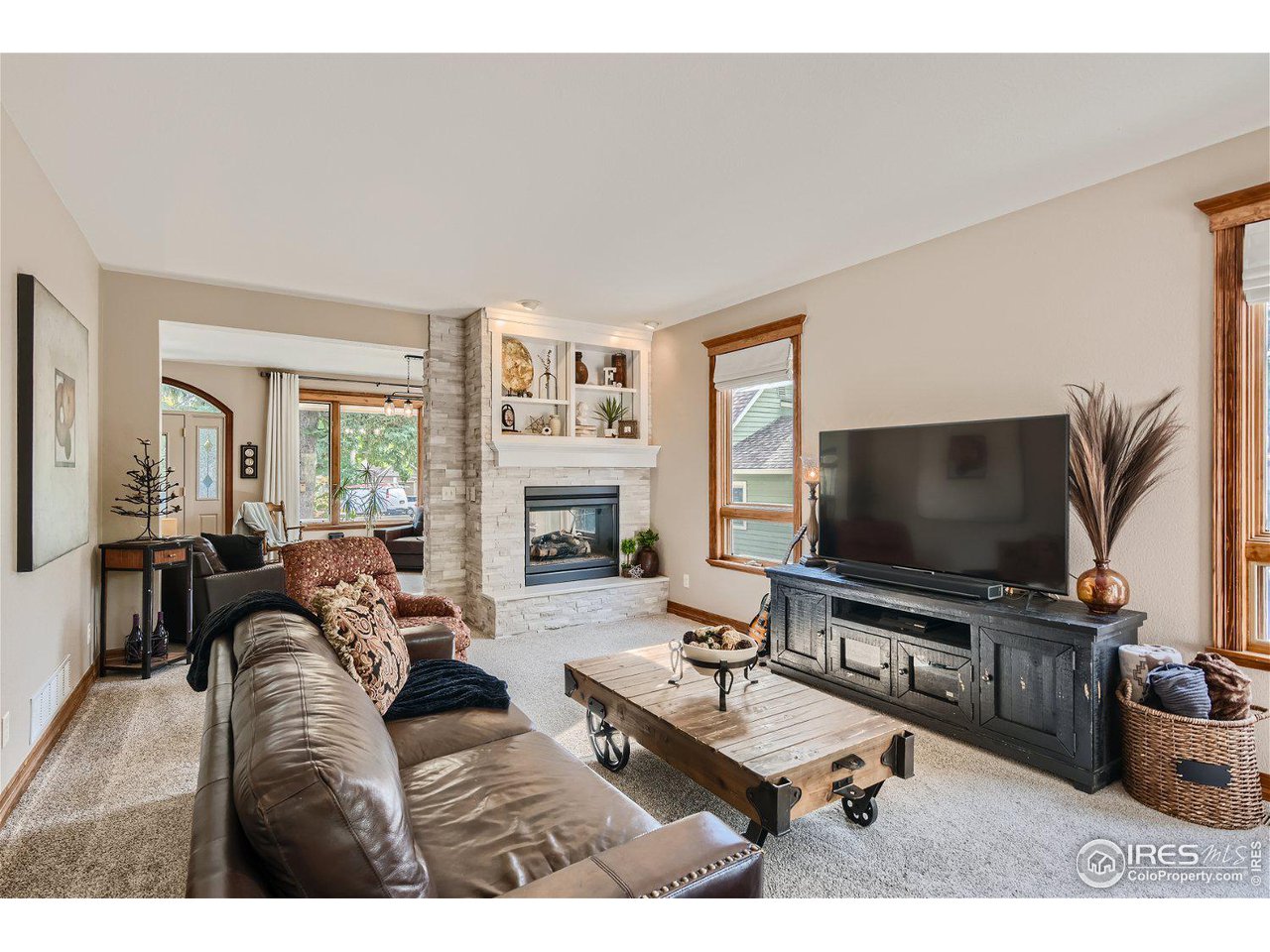 321 North Meldrum Street Fort Collins, CO 80521 - Photo 13 of 40 a living room with furniture and a flat screen tv