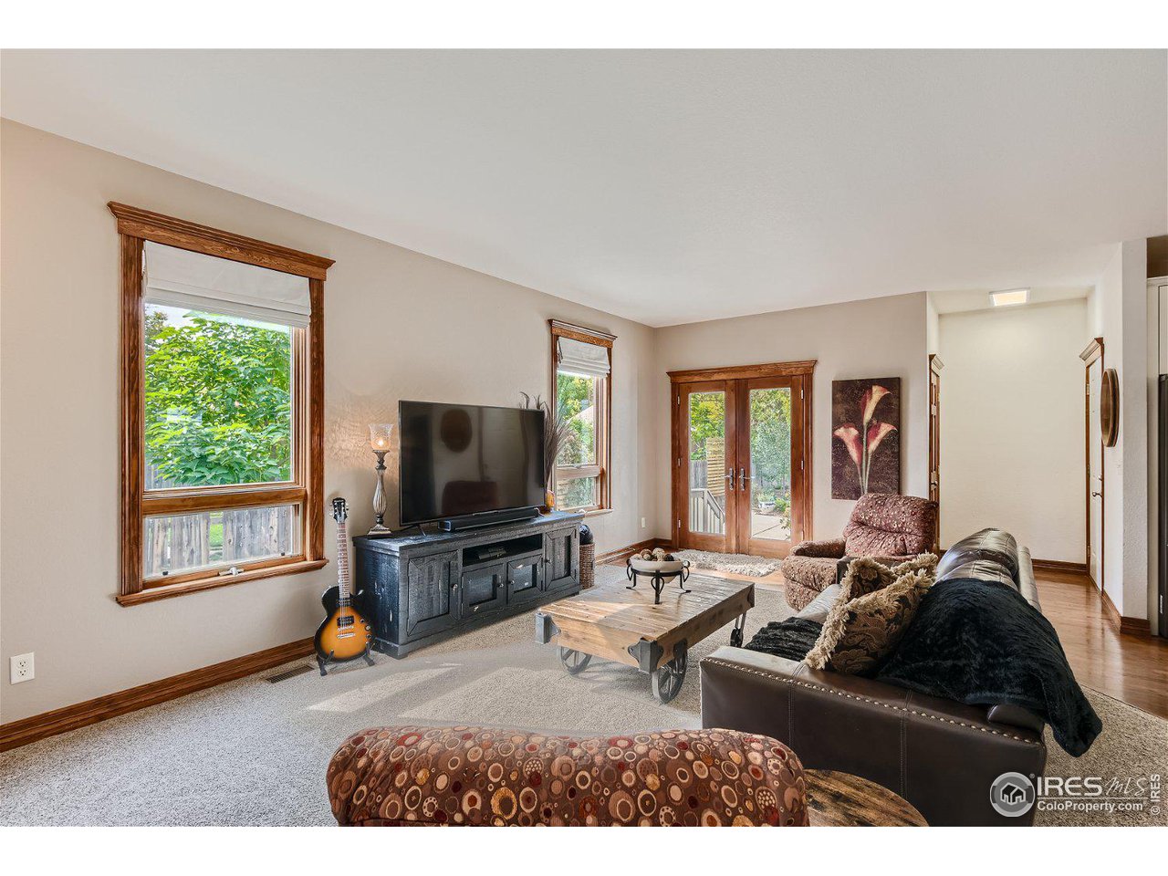 321 North Meldrum Street Fort Collins, CO 80521 - Photo 14 of 40 a living room with furniture and a flat screen tv