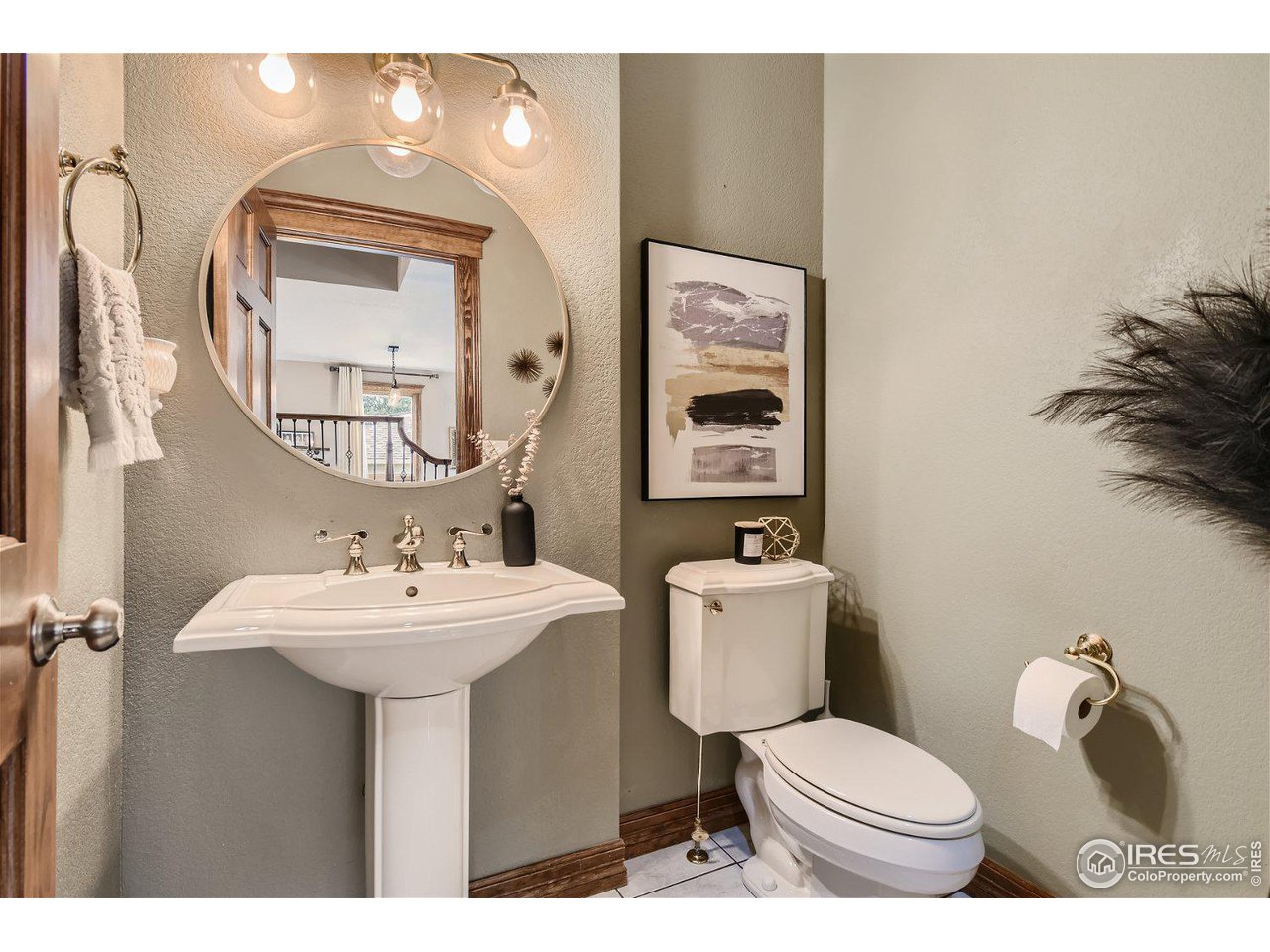 321 North Meldrum Street Fort Collins, CO 80521 - Photo 16 of 40 a bathroom with a toilet sink and mirror