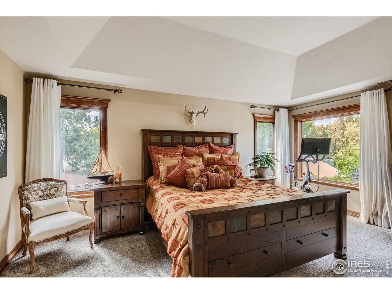 321 North Meldrum Street Fort Collins, CO 80521 - Photo 19 of 40 a bedroom with a bed and a large window