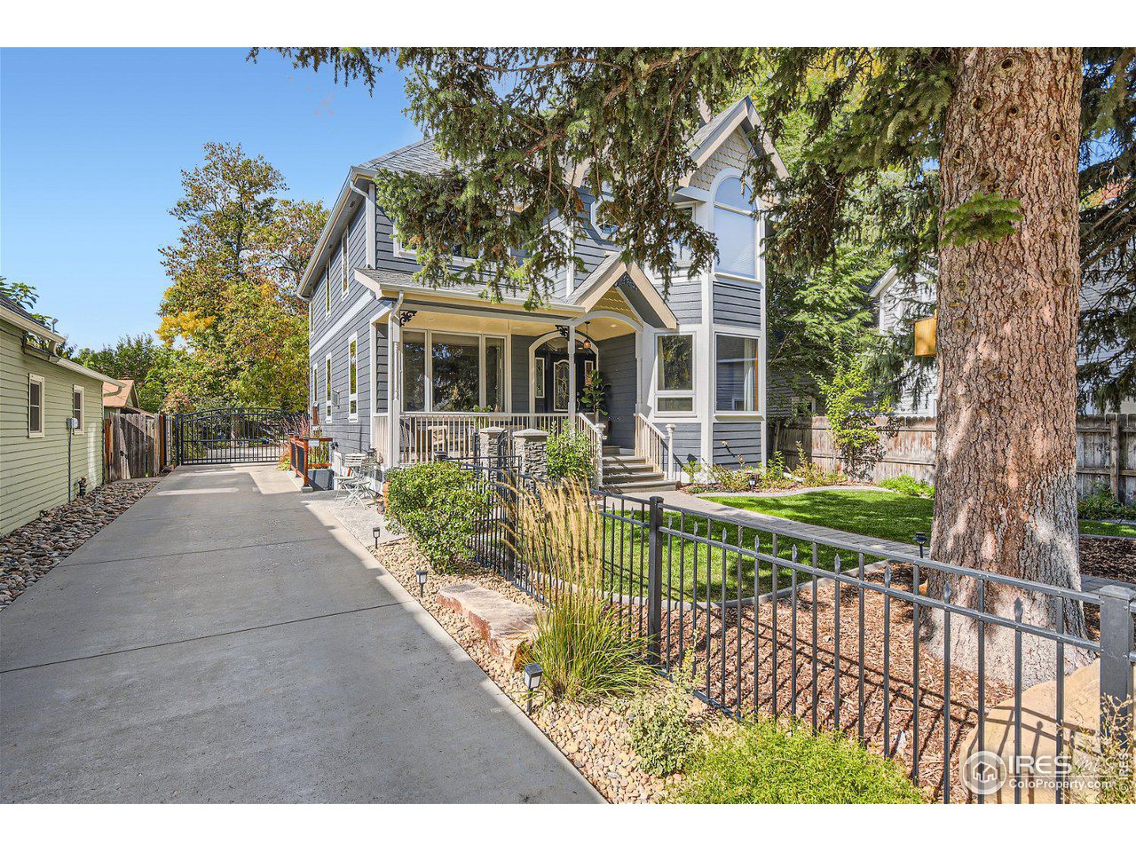 321 North Meldrum Street Fort Collins, CO 80521 - Photo 2 of 40 a view of a house with a yard and potted plants