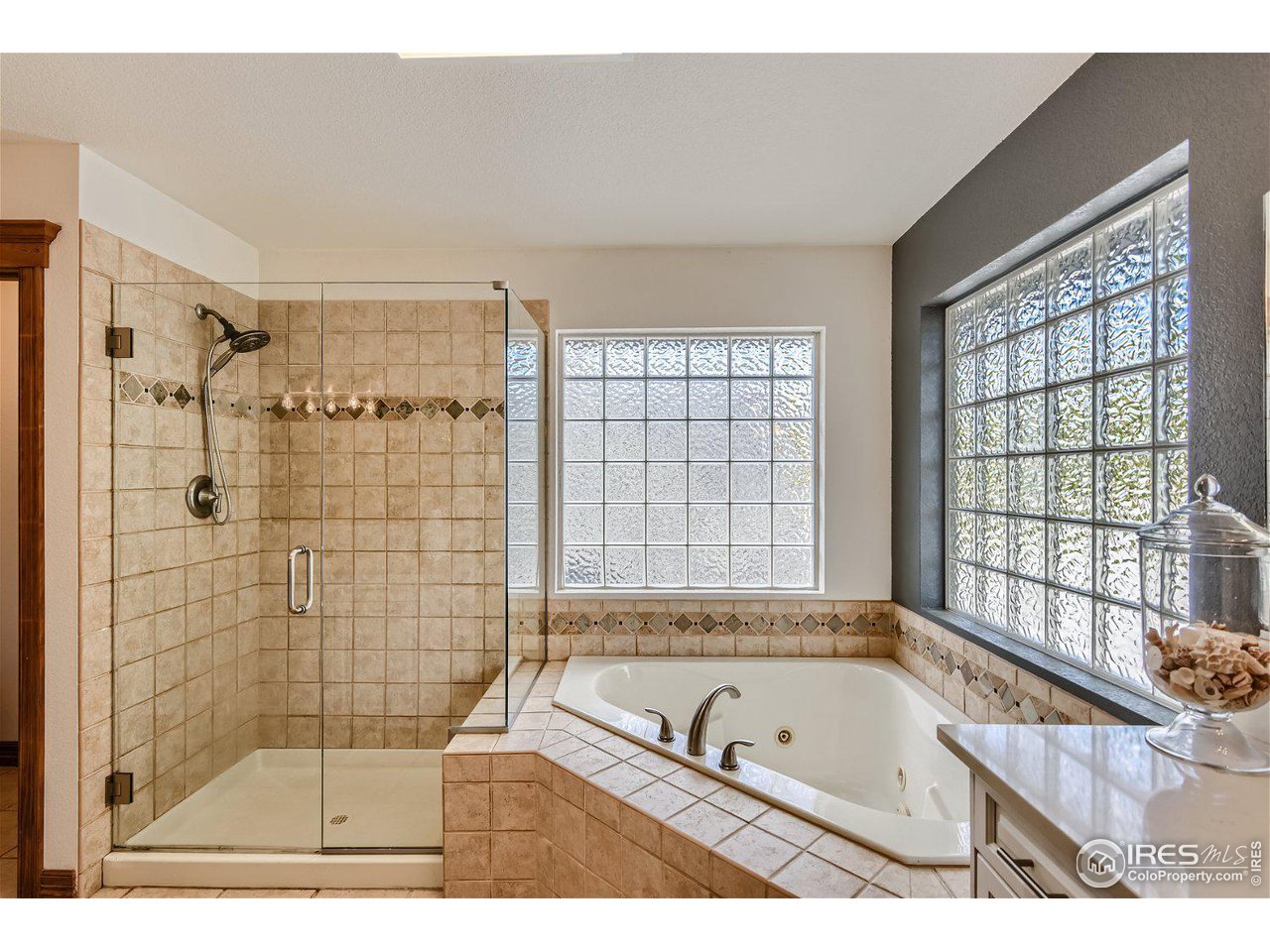 321 North Meldrum Street Fort Collins, CO 80521 - Photo 21 of 40 a bathroom with a tub a sink and a shower