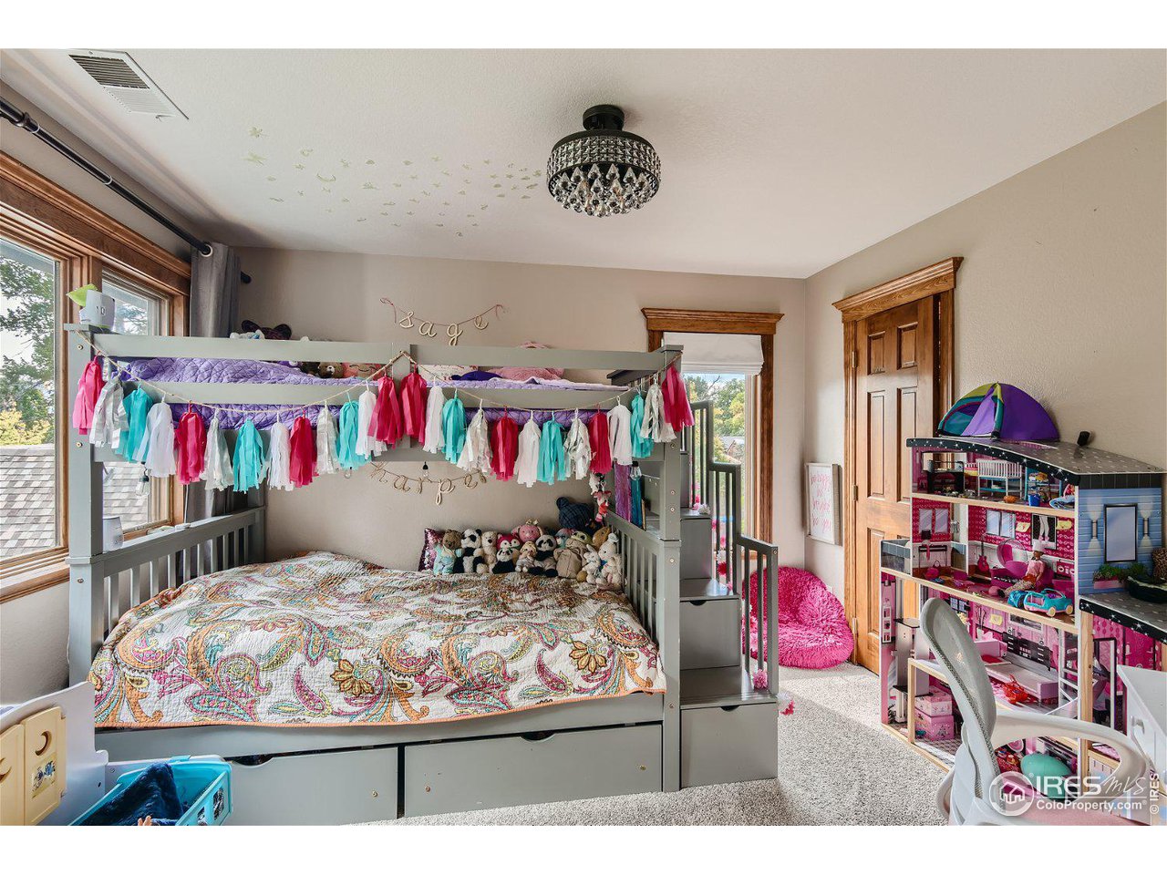 321 North Meldrum Street Fort Collins, CO 80521 - Photo 24 of 40 a bed room with a bed a couch and a book shelf