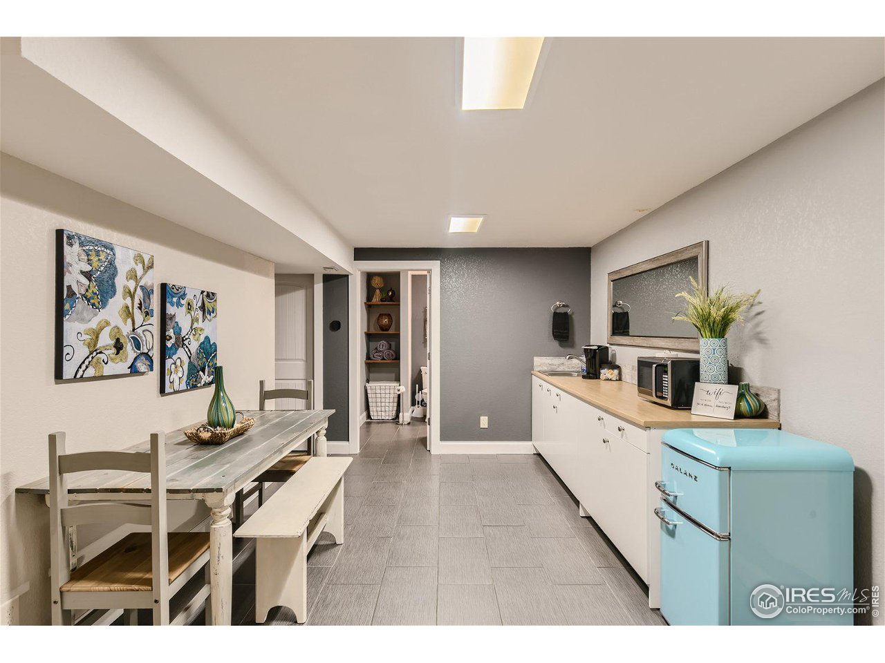 321 North Meldrum Street Fort Collins, CO 80521 - Photo 29 of 40 a living room with furniture and a flat screen tv
