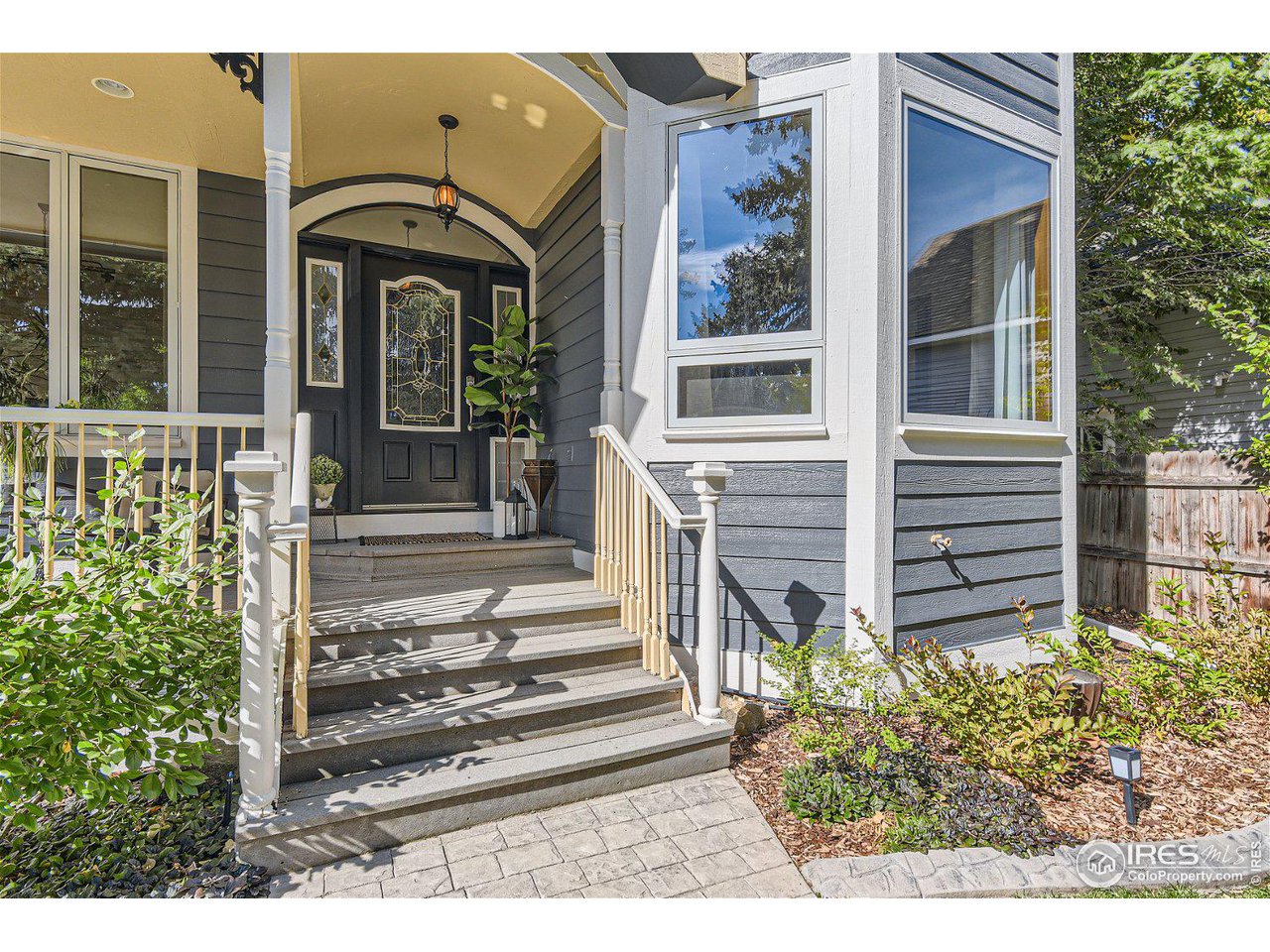 321 North Meldrum Street Fort Collins, CO 80521 - Photo 3 of 40 a front view of a house with a yard
