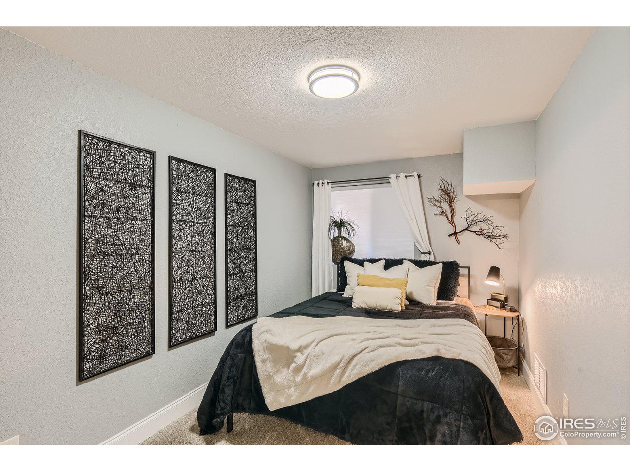 321 North Meldrum Street Fort Collins, CO 80521 - Photo 31 of 40 a bedroom with a bed and a window