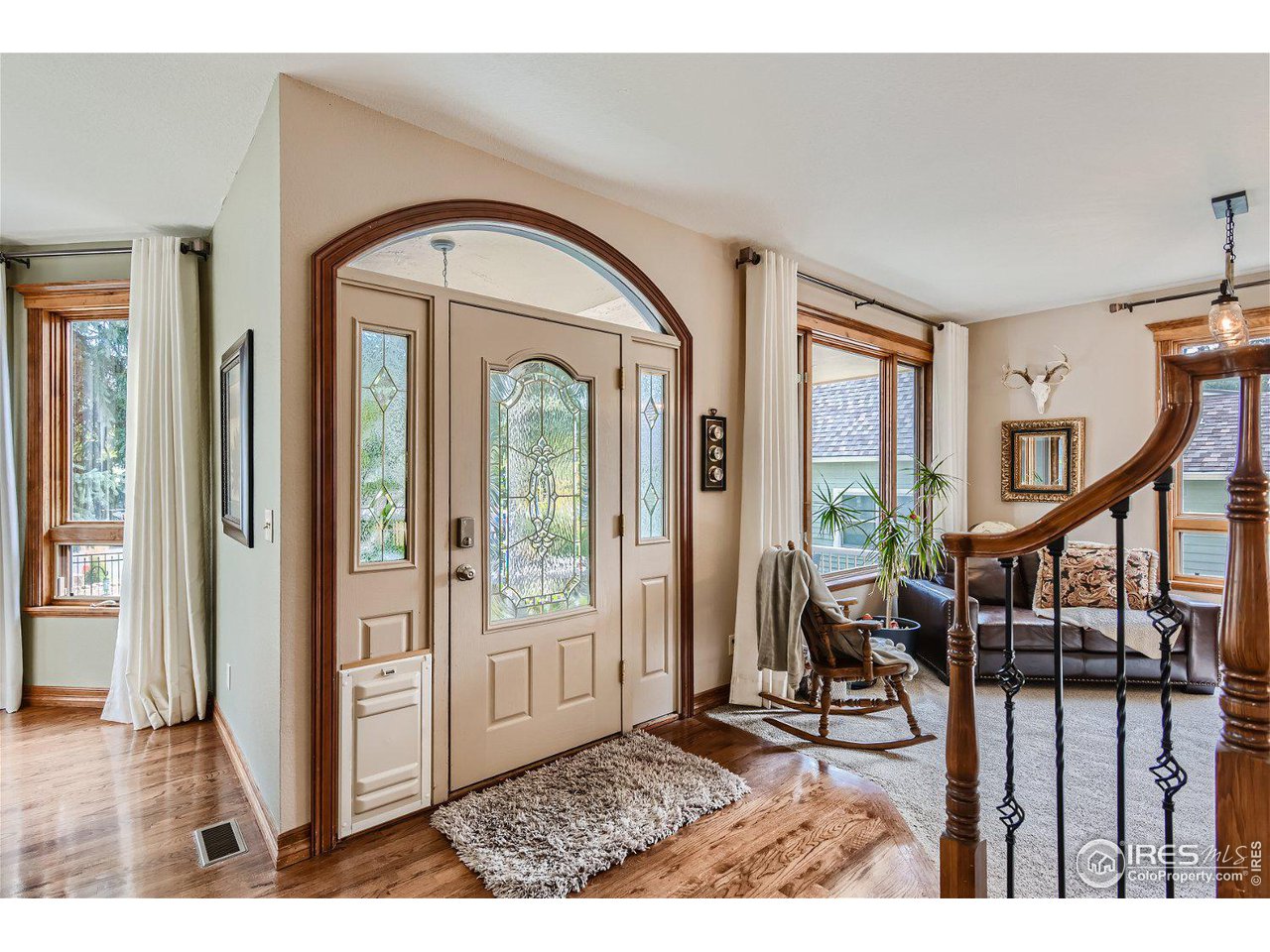 321 North Meldrum Street Fort Collins, CO 80521 - Photo 4 of 40 a view of entryway livingroom and hall with wooden floor
