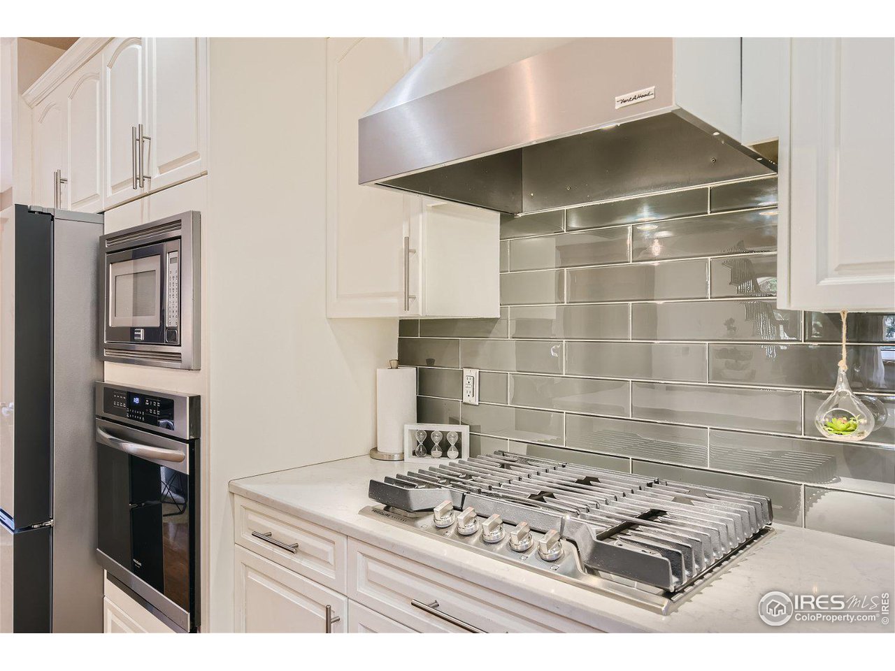 321 North Meldrum Street Fort Collins, CO 80521 - Photo 10 of 40 a white stove top oven sitting inside of a kitchen