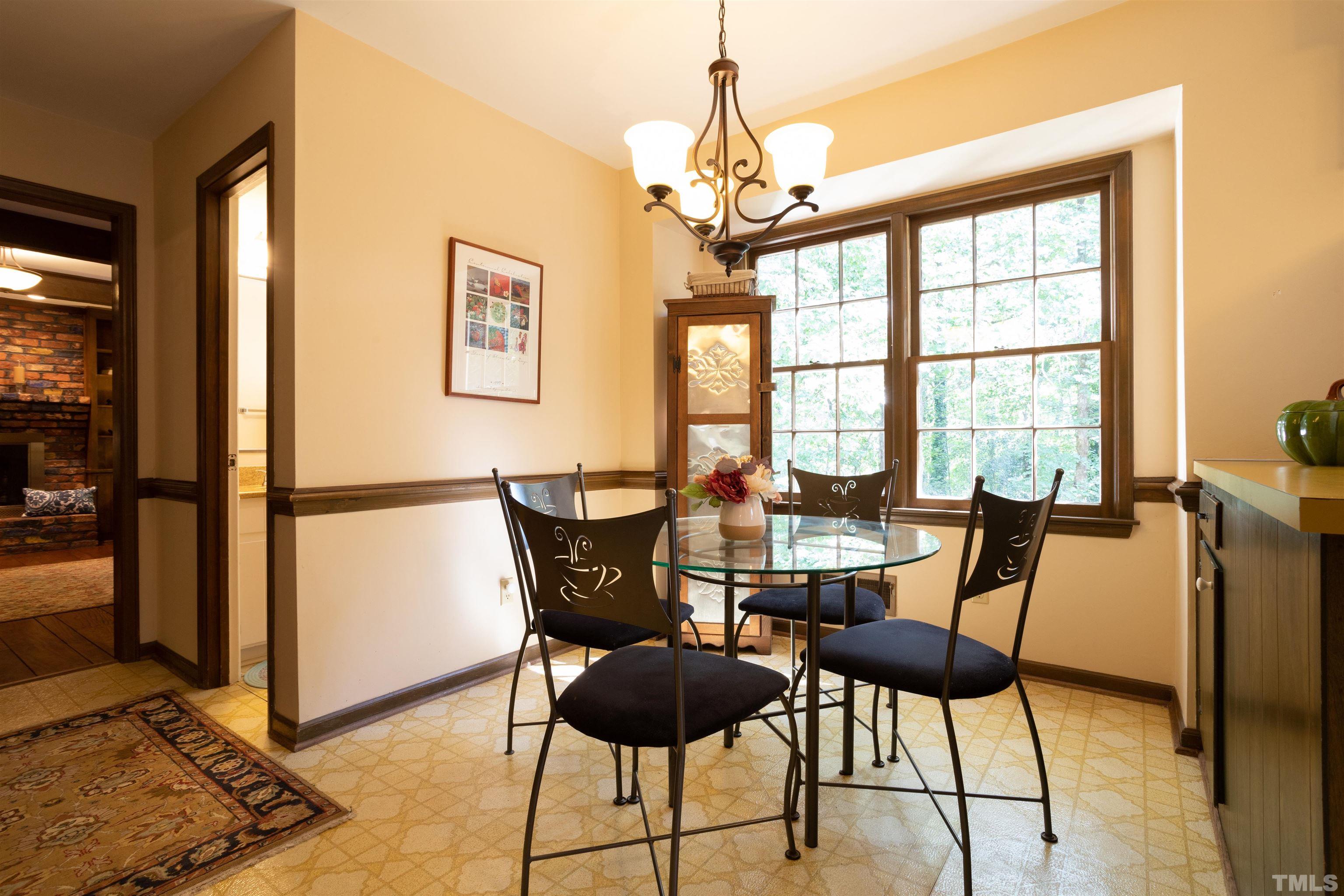 4324 Oak Park Road Raleigh, NC 27612 - Photo 12 of 33 a view of a dining room with furniture and window