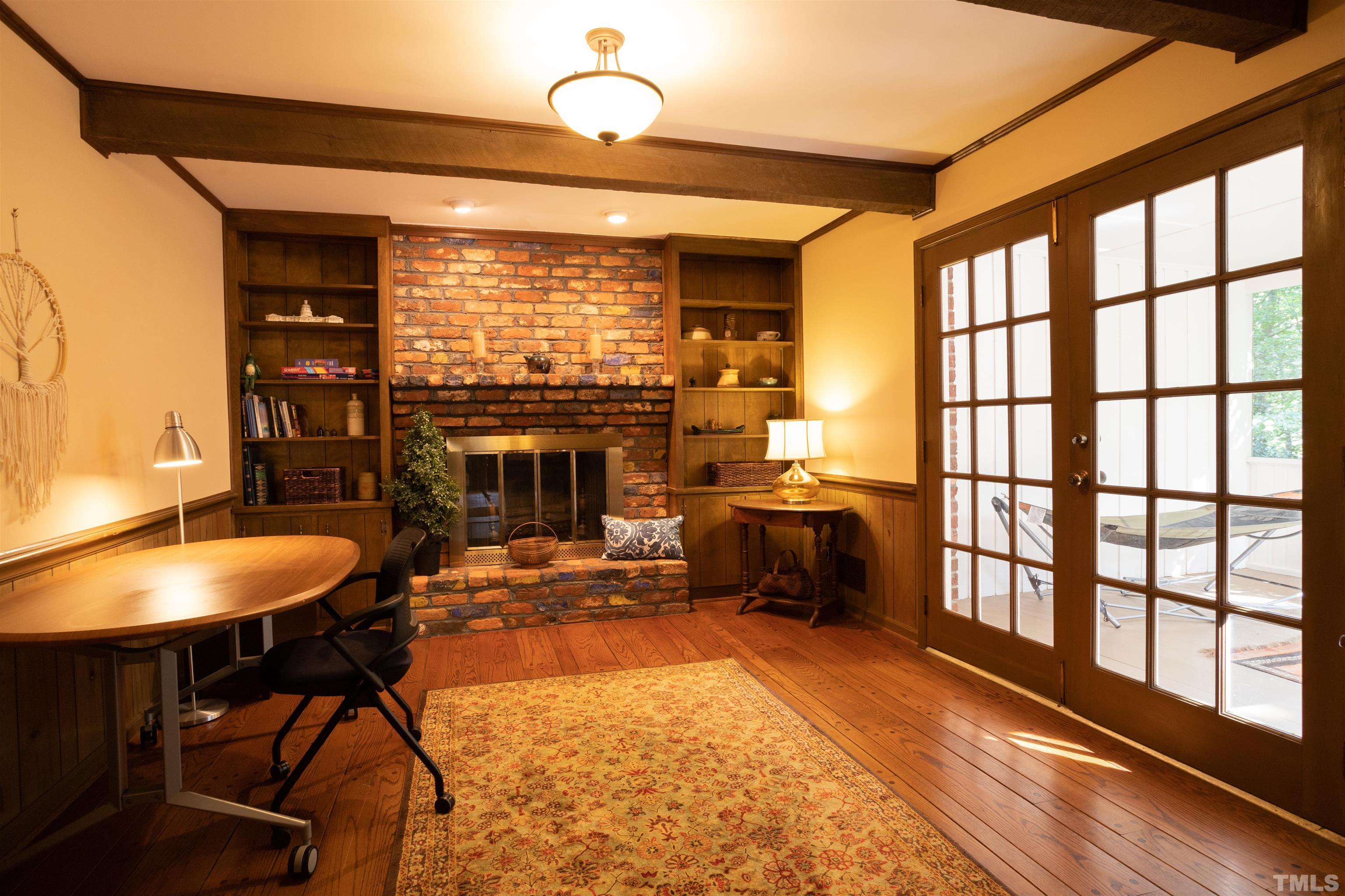 4324 Oak Park Road Raleigh, NC 27612 - Photo 17 of 33 a living room with fireplace furniture and a large window