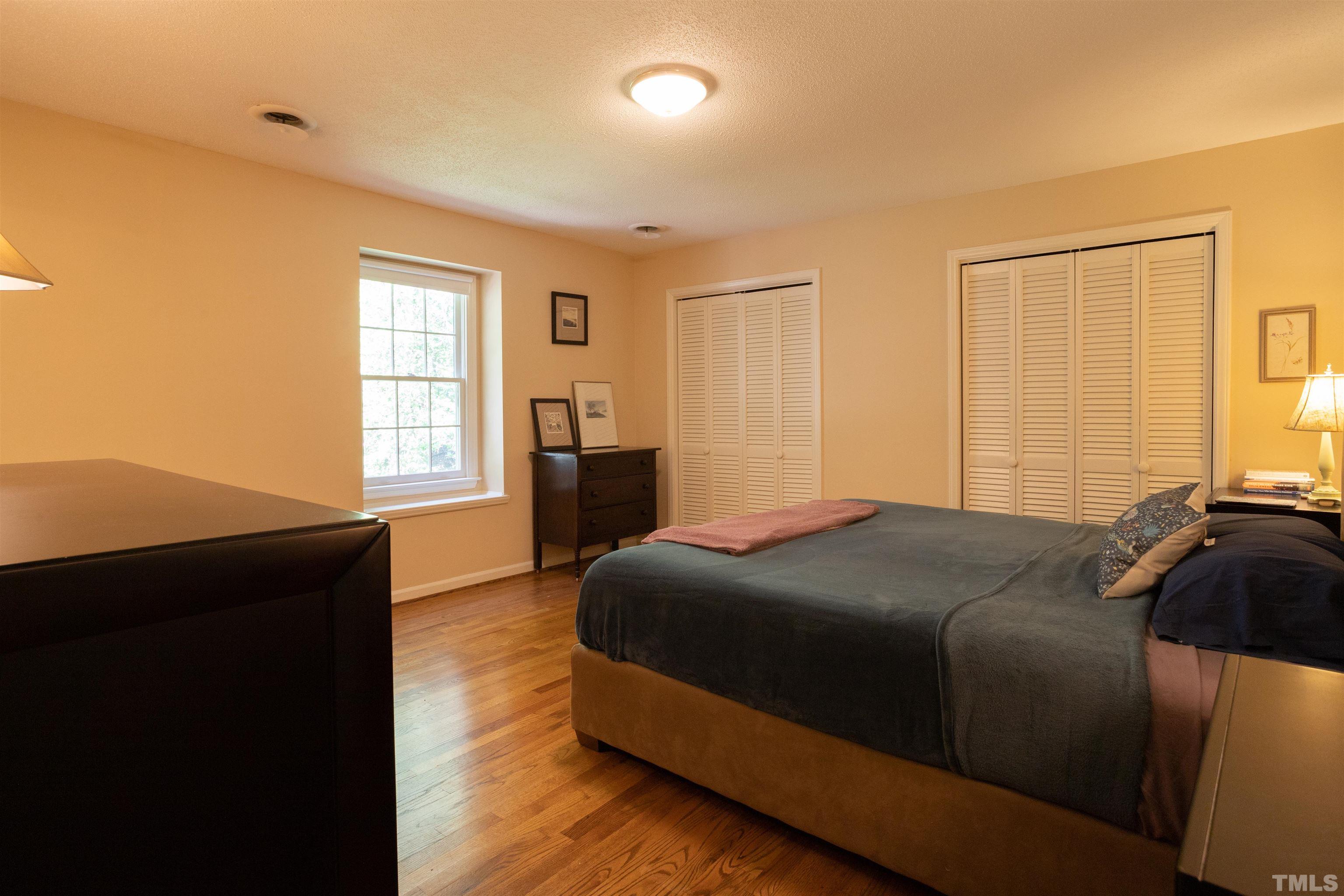 4324 Oak Park Road Raleigh, NC 27612 - Photo 19 of 33 a bedroom with a bed and a window