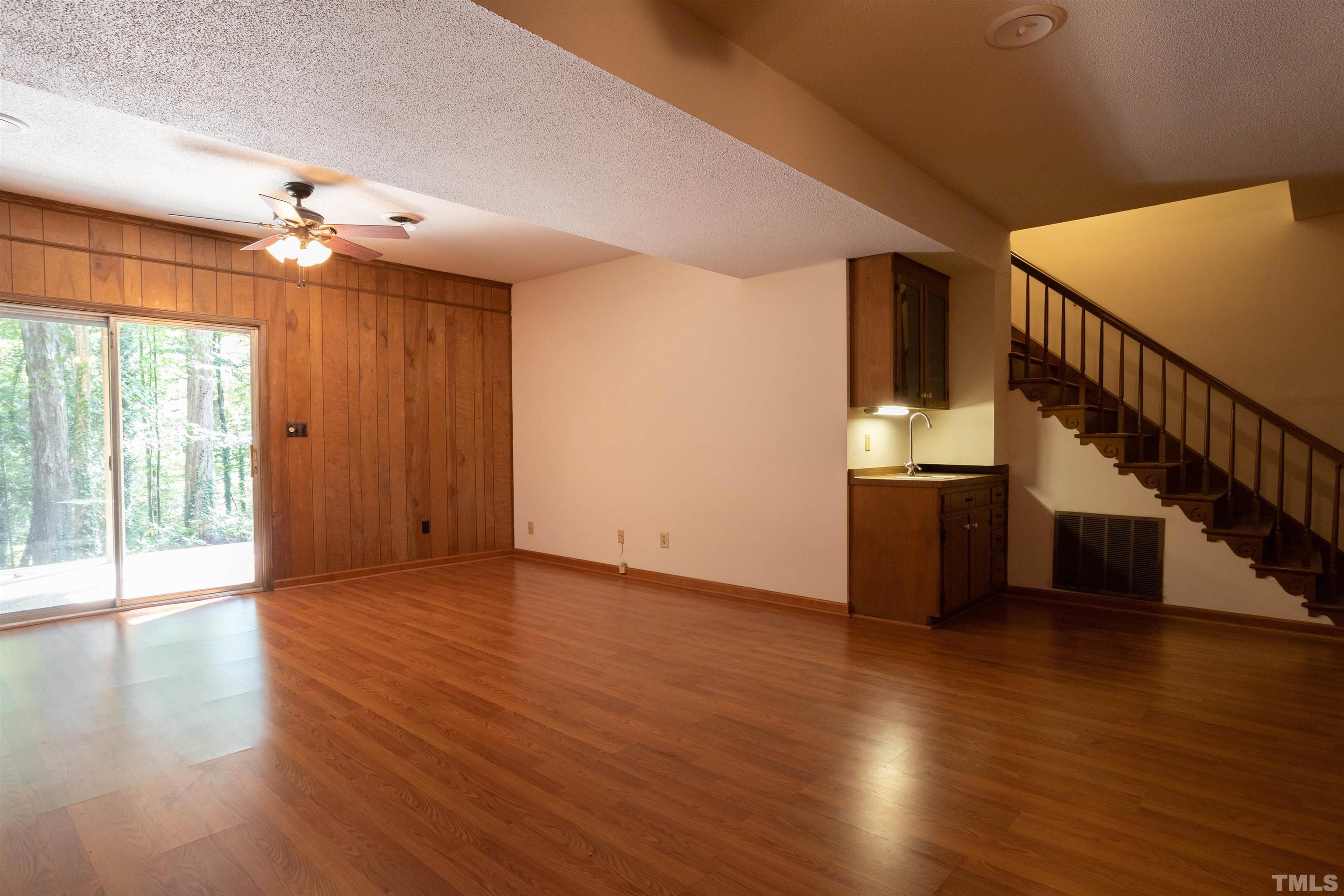 4324 Oak Park Road Raleigh, NC 27612 - Photo 28 of 33 a view of empty room with wooden floor and fan
