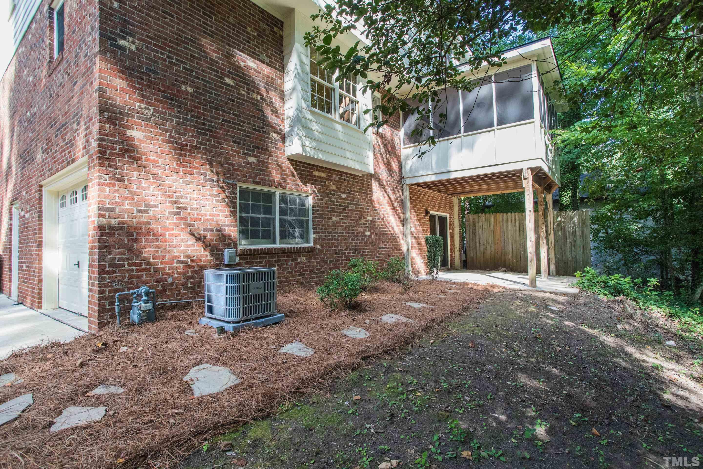 4324 Oak Park Road Raleigh, NC 27612 - Photo 32 of 33 a view of a house with a yard and large tree