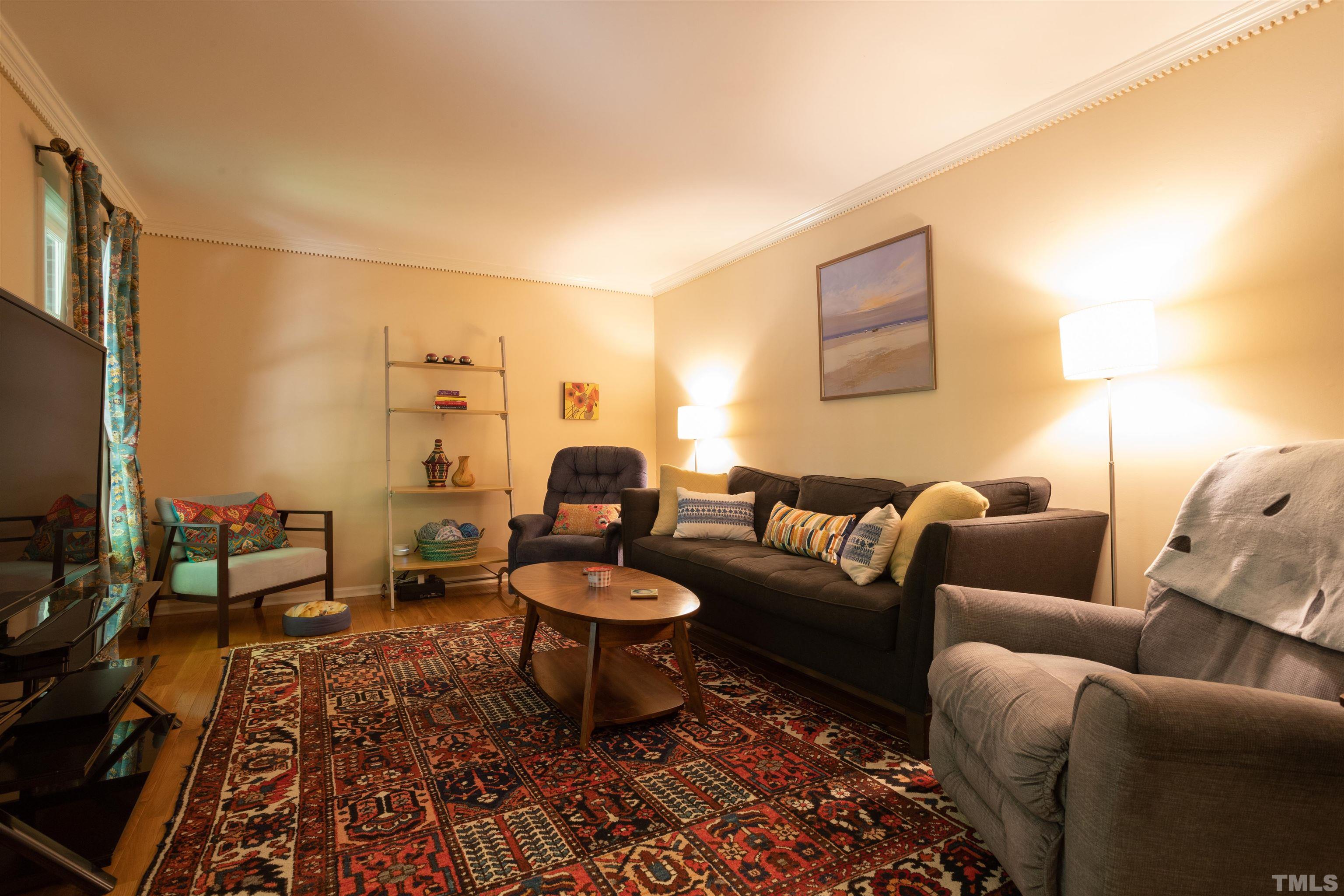 4324 Oak Park Road Raleigh, NC 27612 - Photo 6 of 33 a living room with furniture and a rug