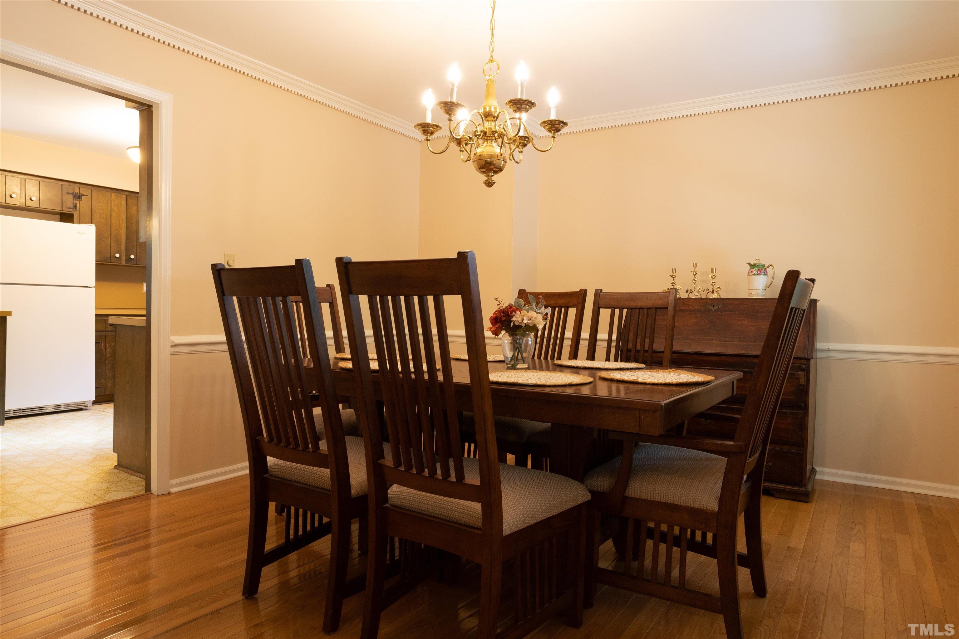4324 Oak Park Road Raleigh, NC 27612 - Photo 7 of 33 a view of a dining room with furniture and wooden floor