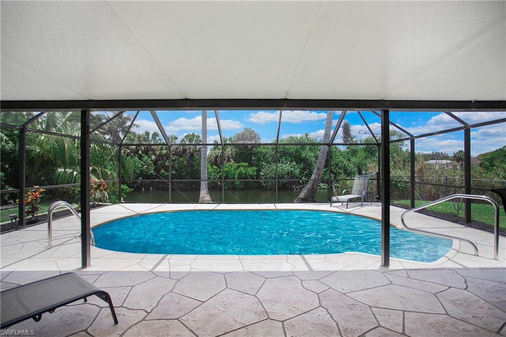 4736 25th Avenue Southwest Naples, FL 34116 - Photo 14 of 22 a view of a swimming pool with a yard