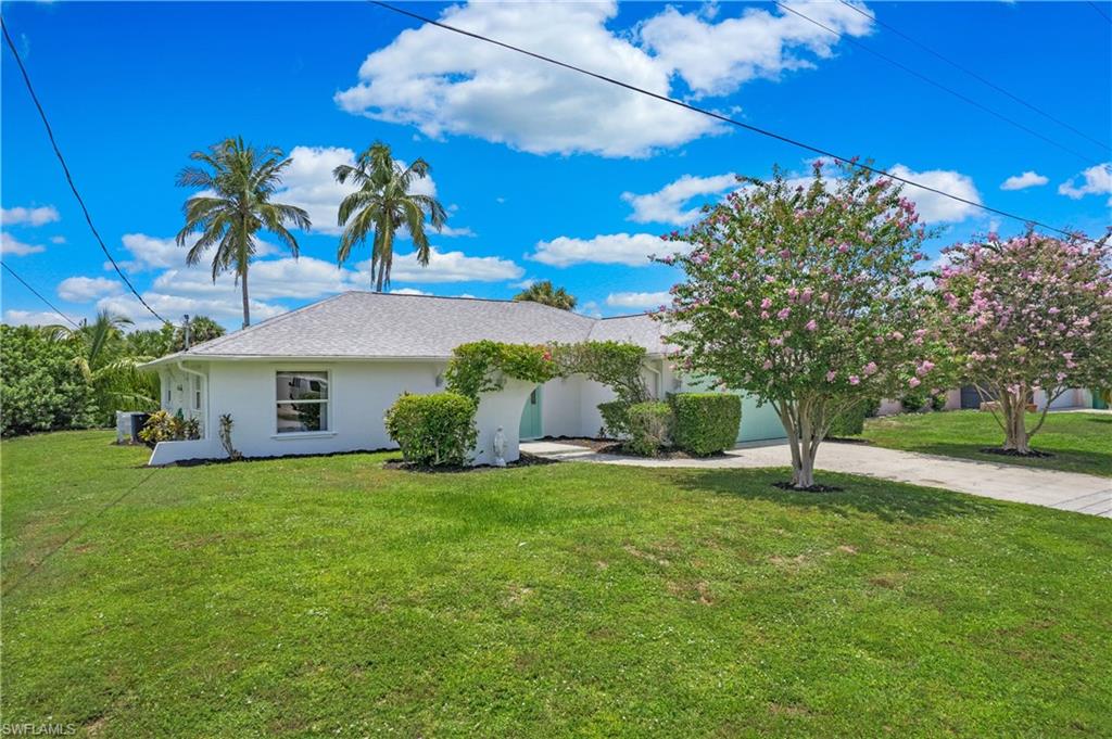 4736 25th Avenue Southwest Naples, FL 34116 - Photo 17 of 22 a view of a house with a big yard