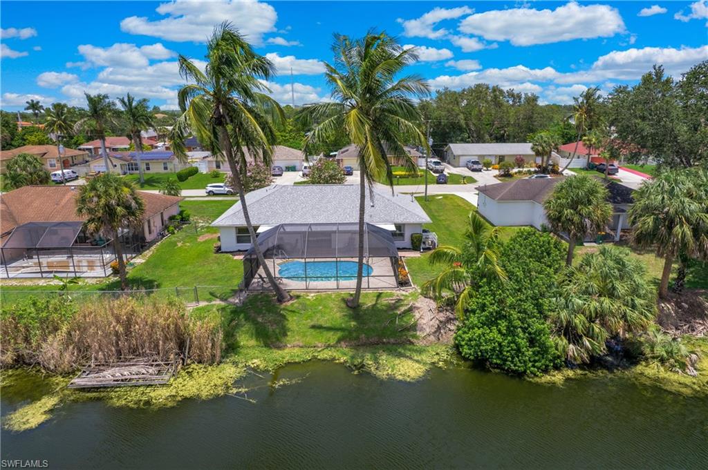 4736 25th Avenue Southwest Naples, FL 34116 - Photo 19 of 22 a view of a garden with a house