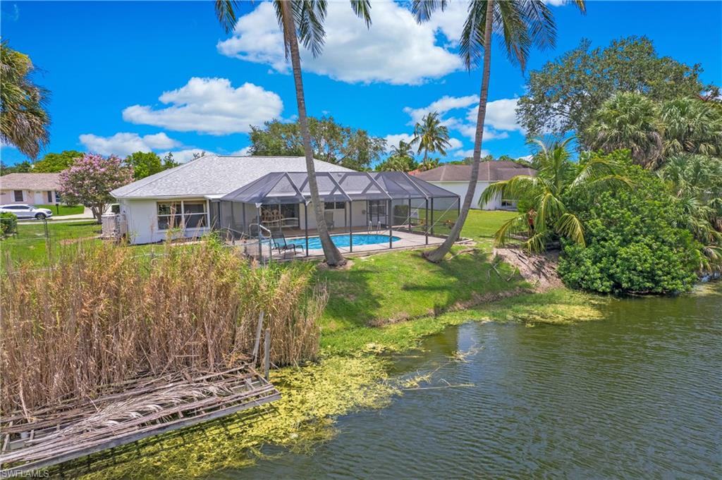 4736 25th Avenue Southwest Naples, FL 34116 - Photo 20 of 22 a view of a house with a yard and sitting area