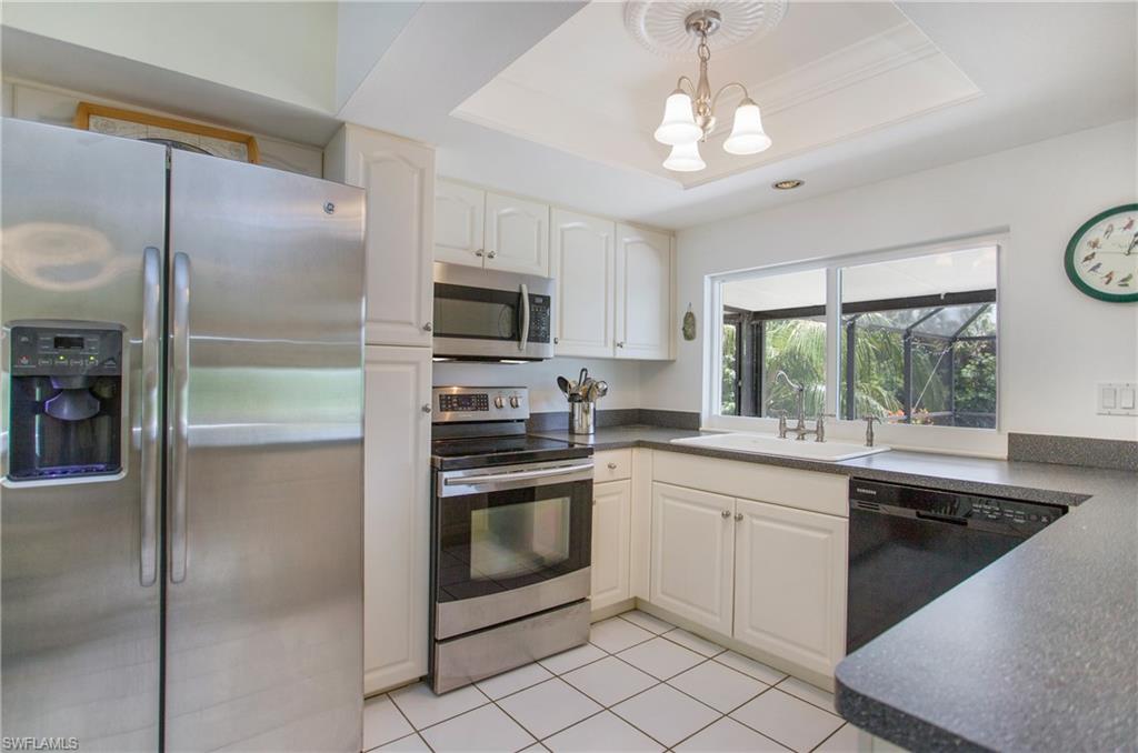 4736 25th Avenue Southwest Naples, FL 34116 - Photo 4 of 22 a kitchen with a sink stainless steel appliances and window