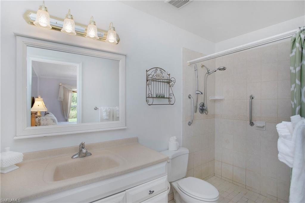 4736 25th Avenue Southwest Naples, FL 34116 - Photo 10 of 22 a bathroom with a sink toilet and shower