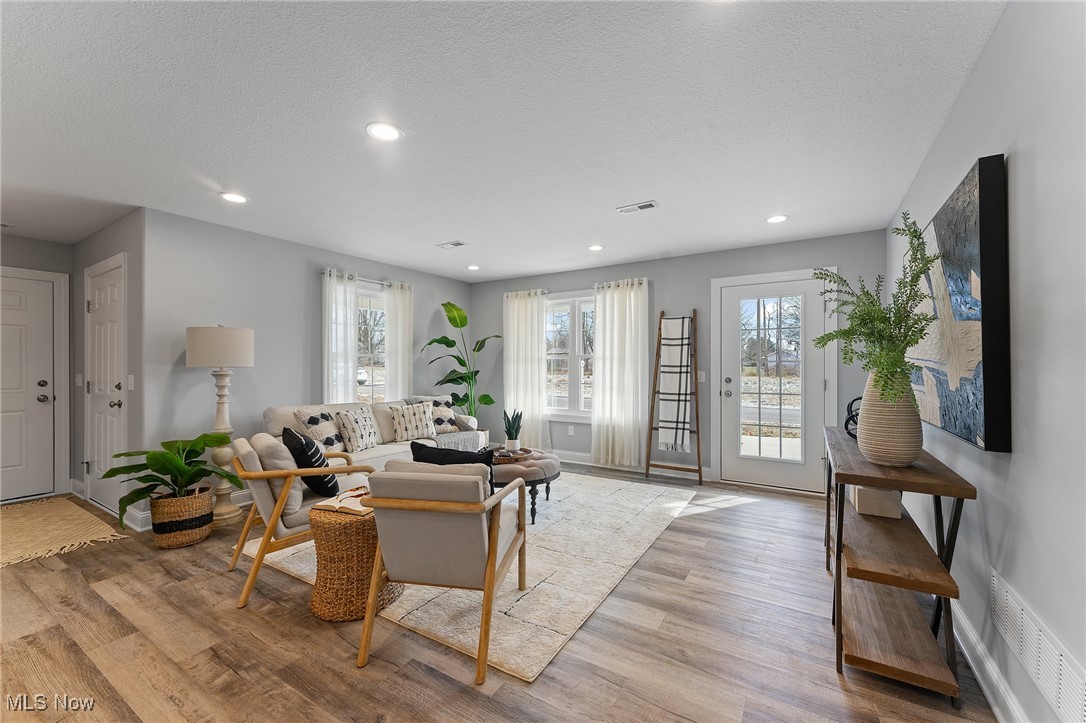 603 South Raccoon Road, Unit 61 Youngstown, OH 44515 - Photo 2 of 25 Great room with recessed lighting and lvt flooring