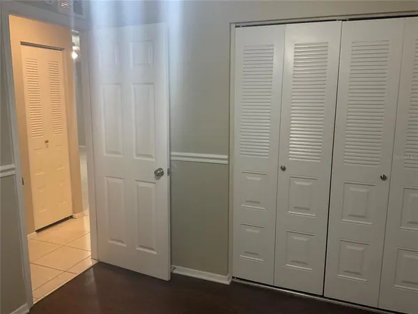 a view of a closet area with entryway